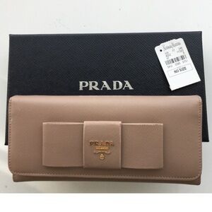 Prada saffiano pink beige gold leather bow tie continental wallet classic design